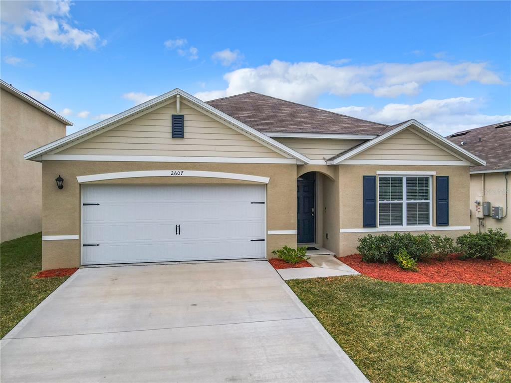2607 Elmbrooke Way Edgewater, FL 32141 - Photo 51 of 52 a front view of a house with garden