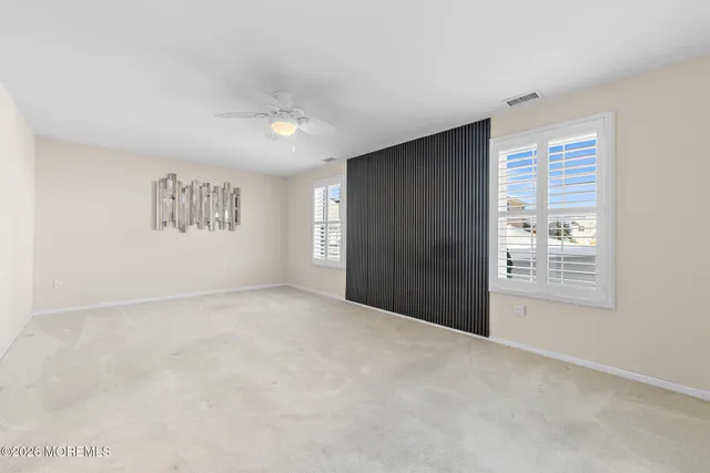 a dining room with furniture a chandelier and wooden floor