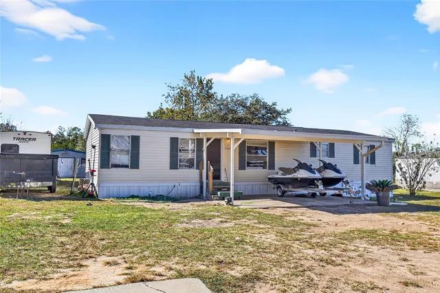 a front view of house with yard and seating area
