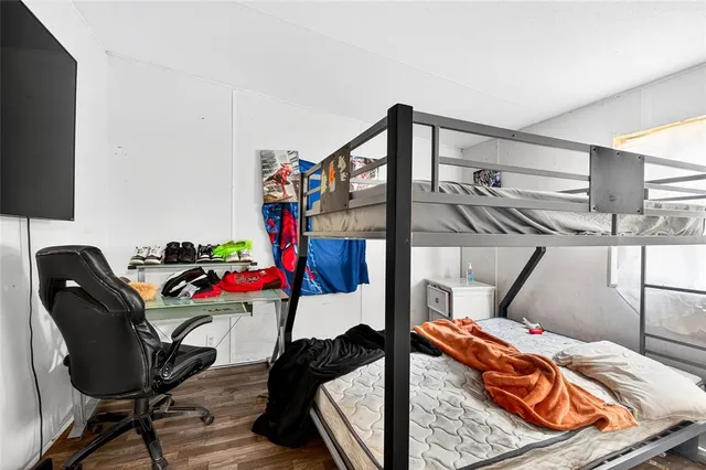 a bedroom with a workspace