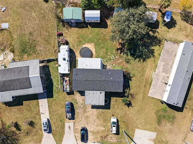 an aerial view of residential houses with outdoor space