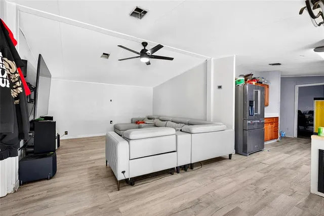 a room with furniture and a flat screen tv