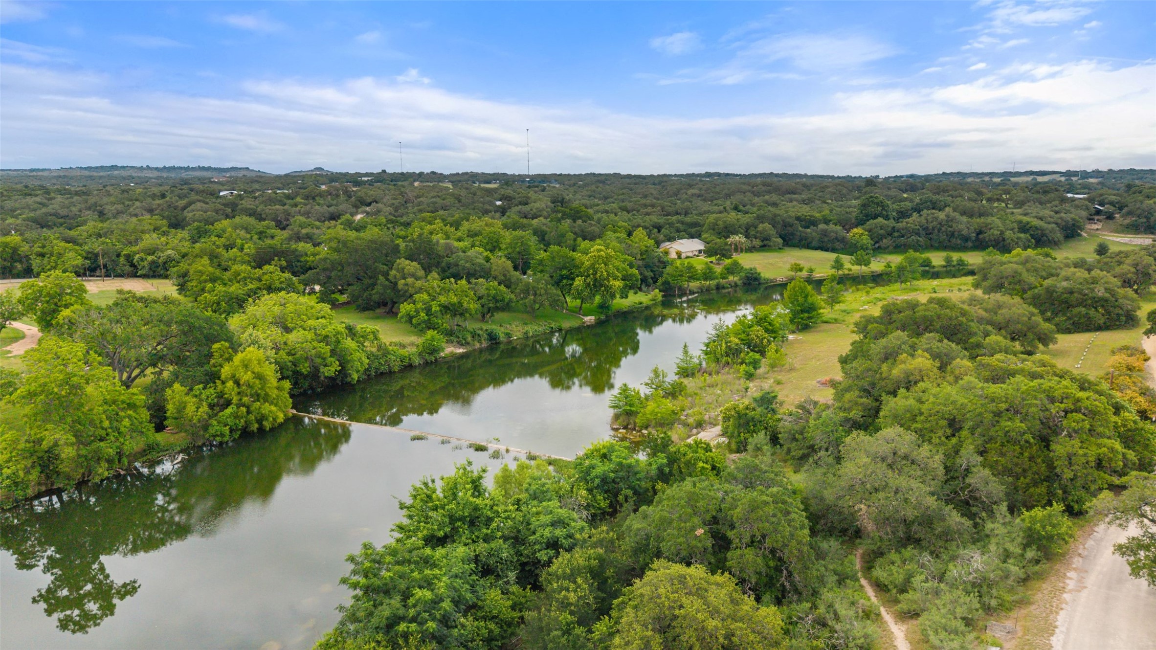 701 River Road Blanco, TX 78606 - Photo 2 of 38 a view of a lake with a city