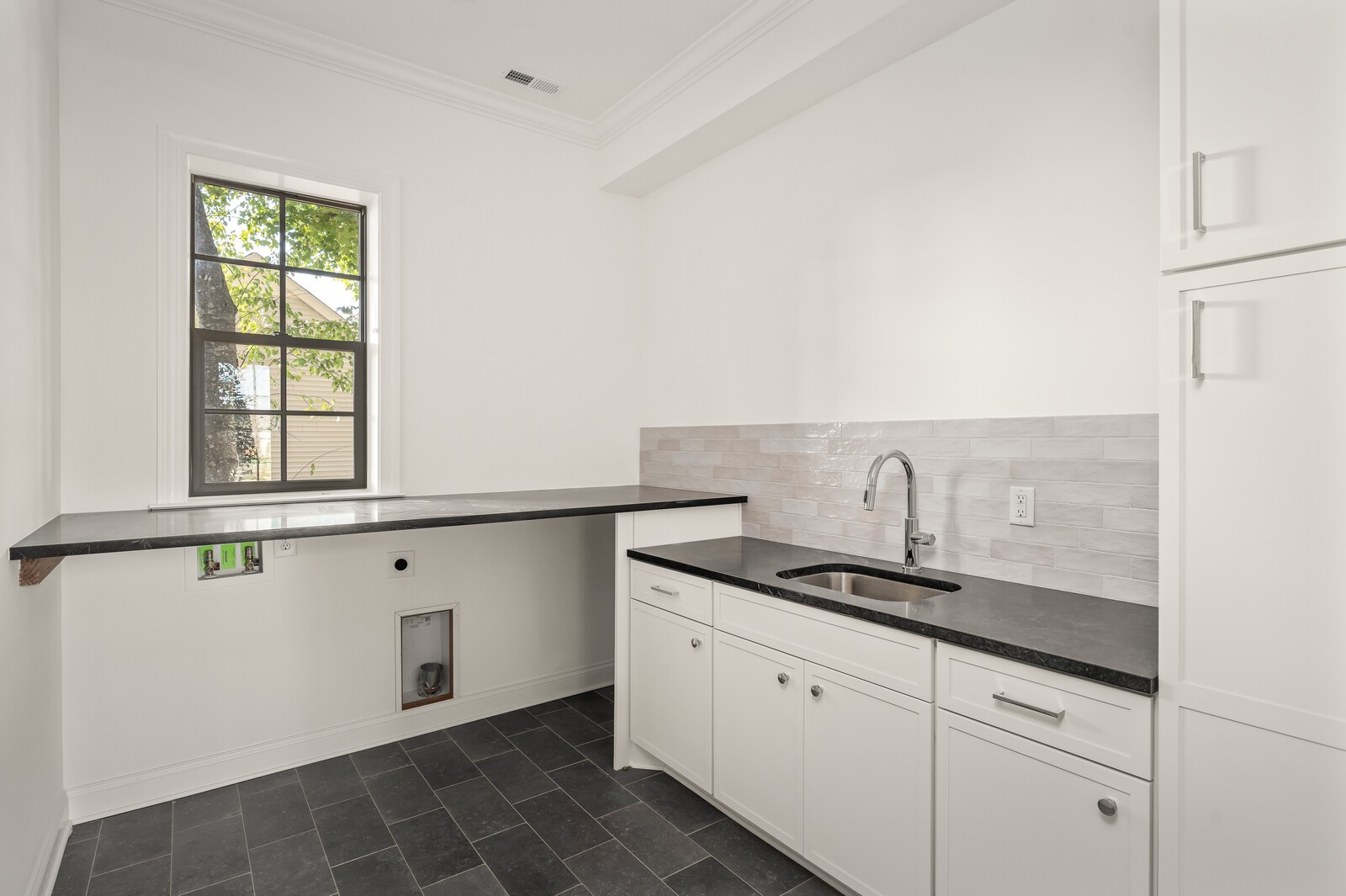 2925 Torrence Trail Spring Hill, TN 37174 - Photo 16 of 22 a kitchen with granite countertop a sink and a white cabinets