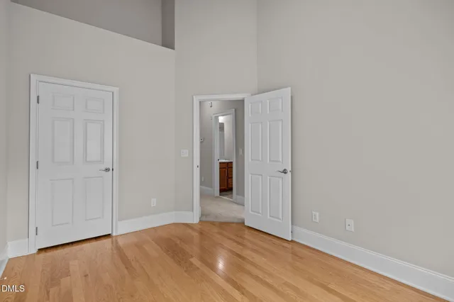 a view of an empty room and wooden floor