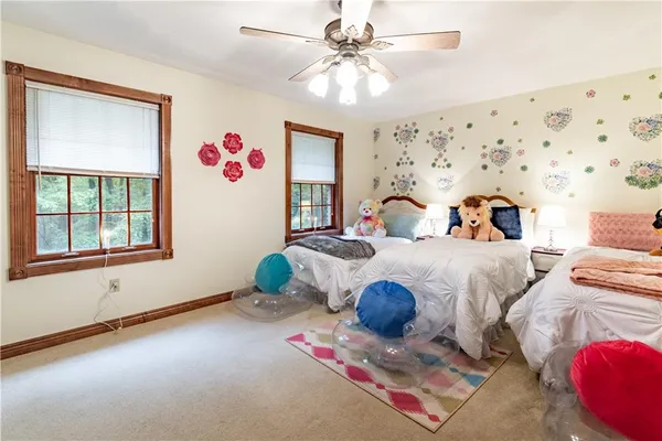 a bedroom with furniture and a chandelier