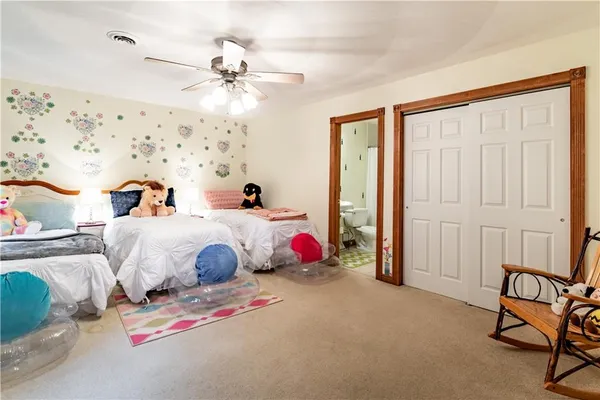 a bedroom with bed and window