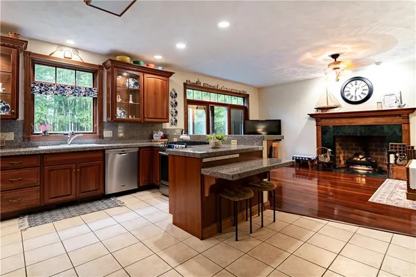 a kitchen with a sink and a stove top oven