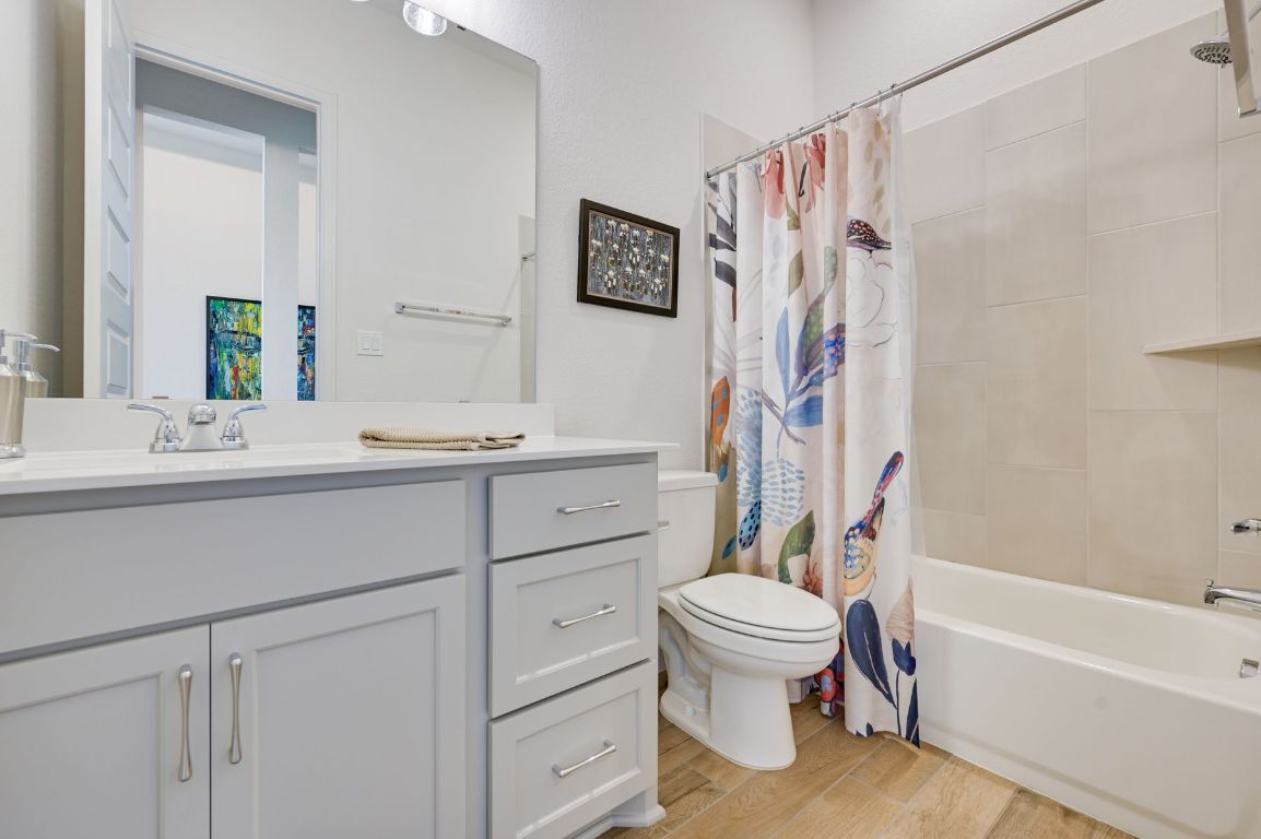 273 Fawn Riv Run Kyle, TX 78640 - Photo 17 of 27 a bathroom with a sink a toilet and a bathtub