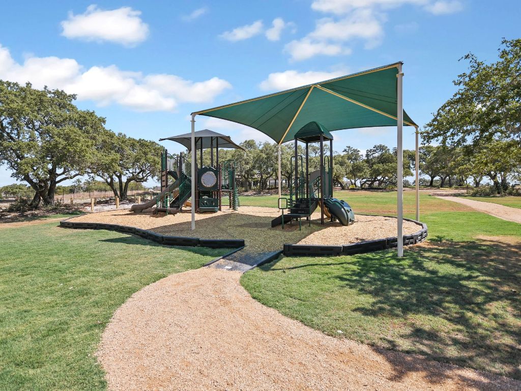 273 Fawn Riv Run Kyle, TX 78640 - Photo 24 of 27 a view of a park with slide