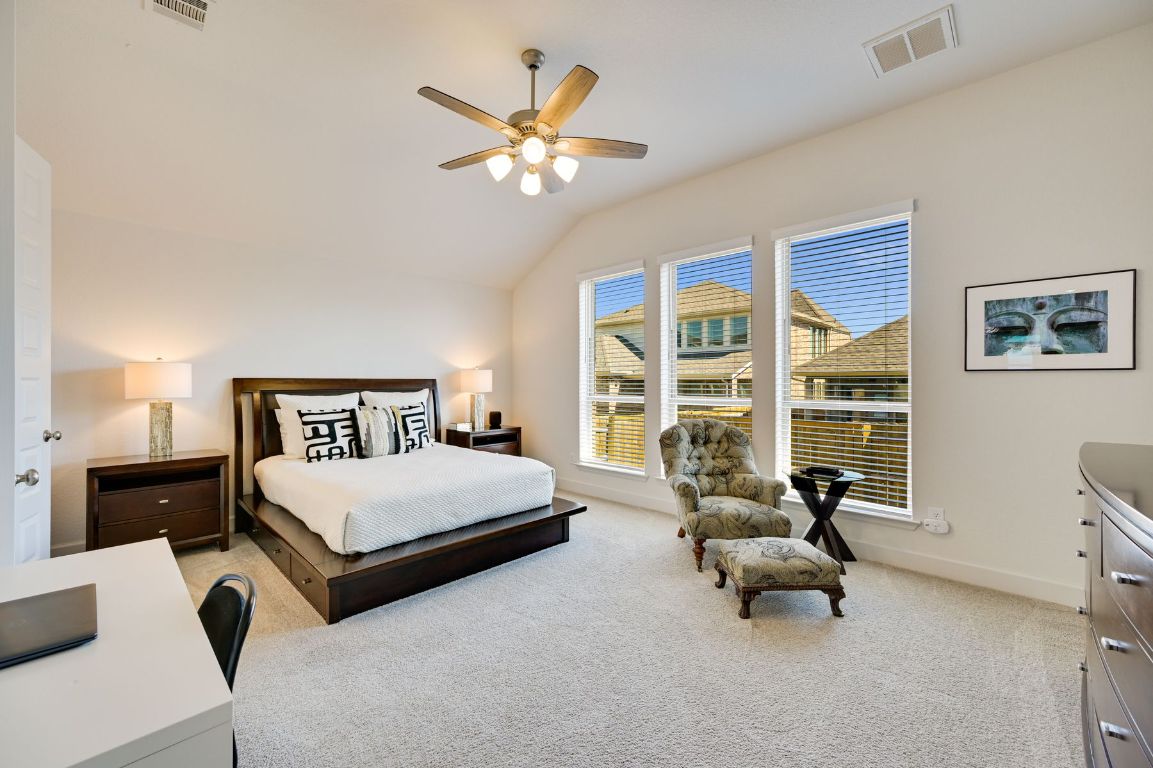 273 Fawn Riv Run Kyle, TX 78640 - Photo 10 of 27 a living room with furniture and a large window