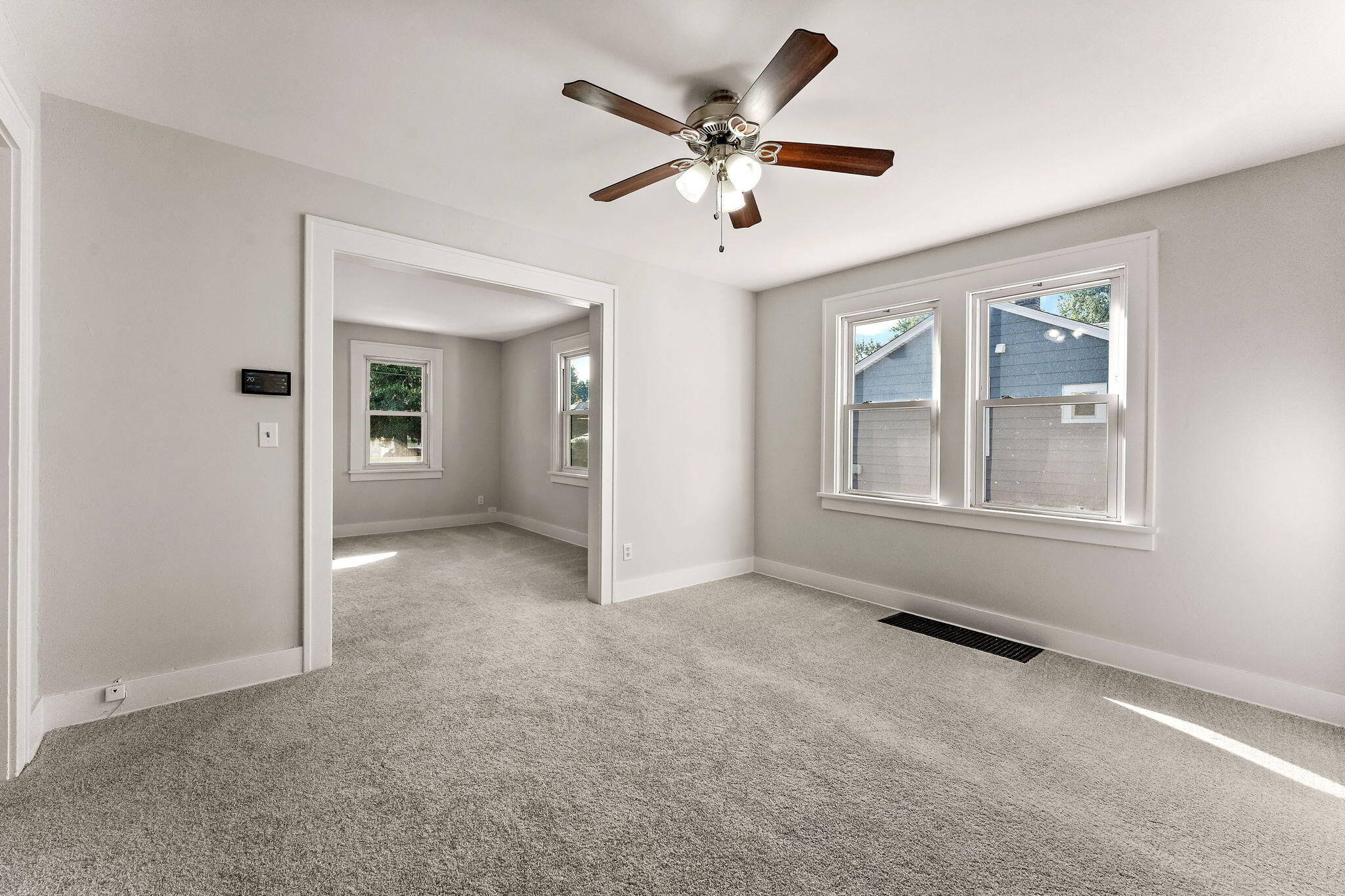 511 North West Street Crown Point, IN 46307 - Photo 13 of 17 an empty room with chandelier fan and windows