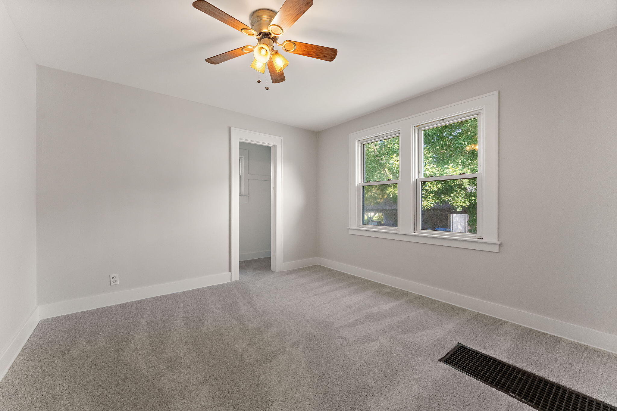 511 North West Street Crown Point, IN 46307 - Photo 16 of 17 an empty room with windows and chandelier fan