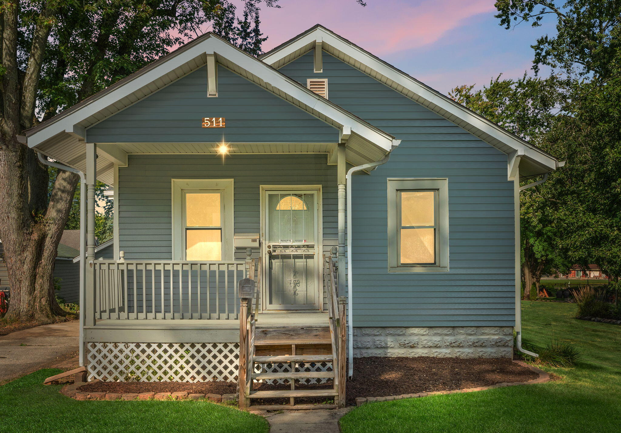 511 North West Street Crown Point, IN 46307 - Photo 2 of 17 a front view of a house with a garden