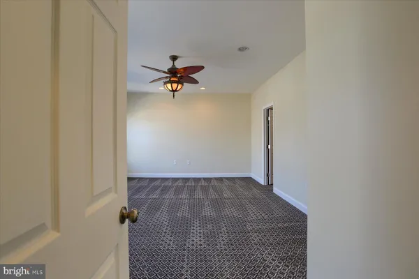 a view of a hallway with a closet