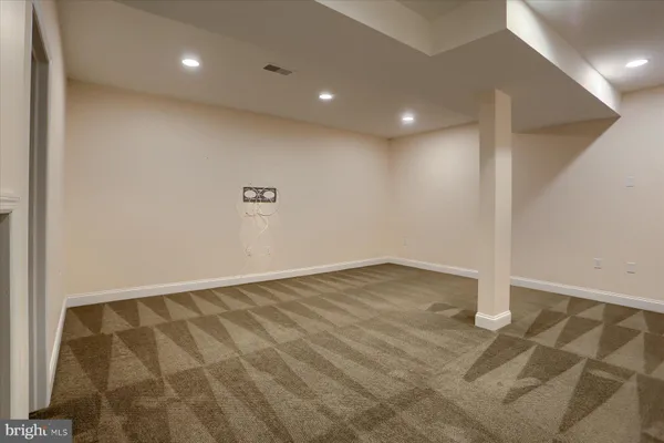 an empty room with wooden floor
