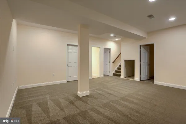a view of an empty room with a fireplace