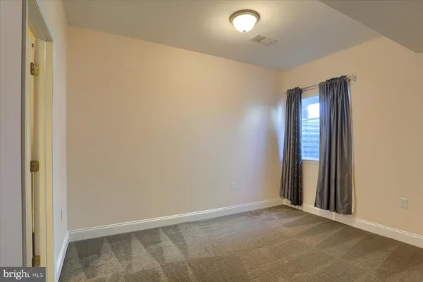 an empty room with a hallway