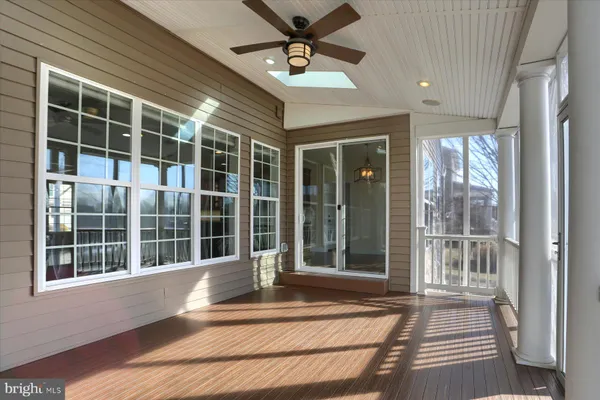 a view of balcony with wooden floor
