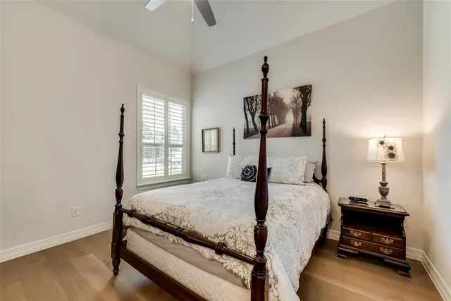 a bed room with a bed and a window