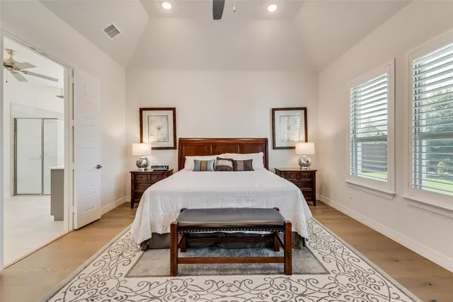 a bed room with a bed and a window