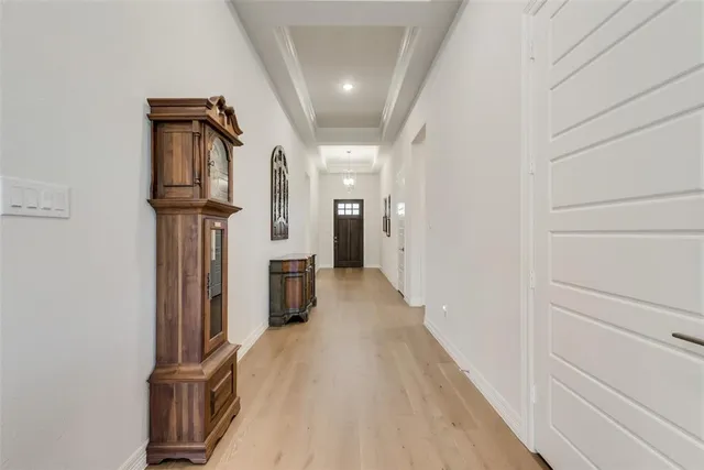 a view of a hallway with a white walls