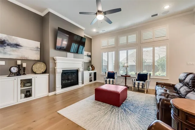 a living room with furniture fireplace and flat screen tv
