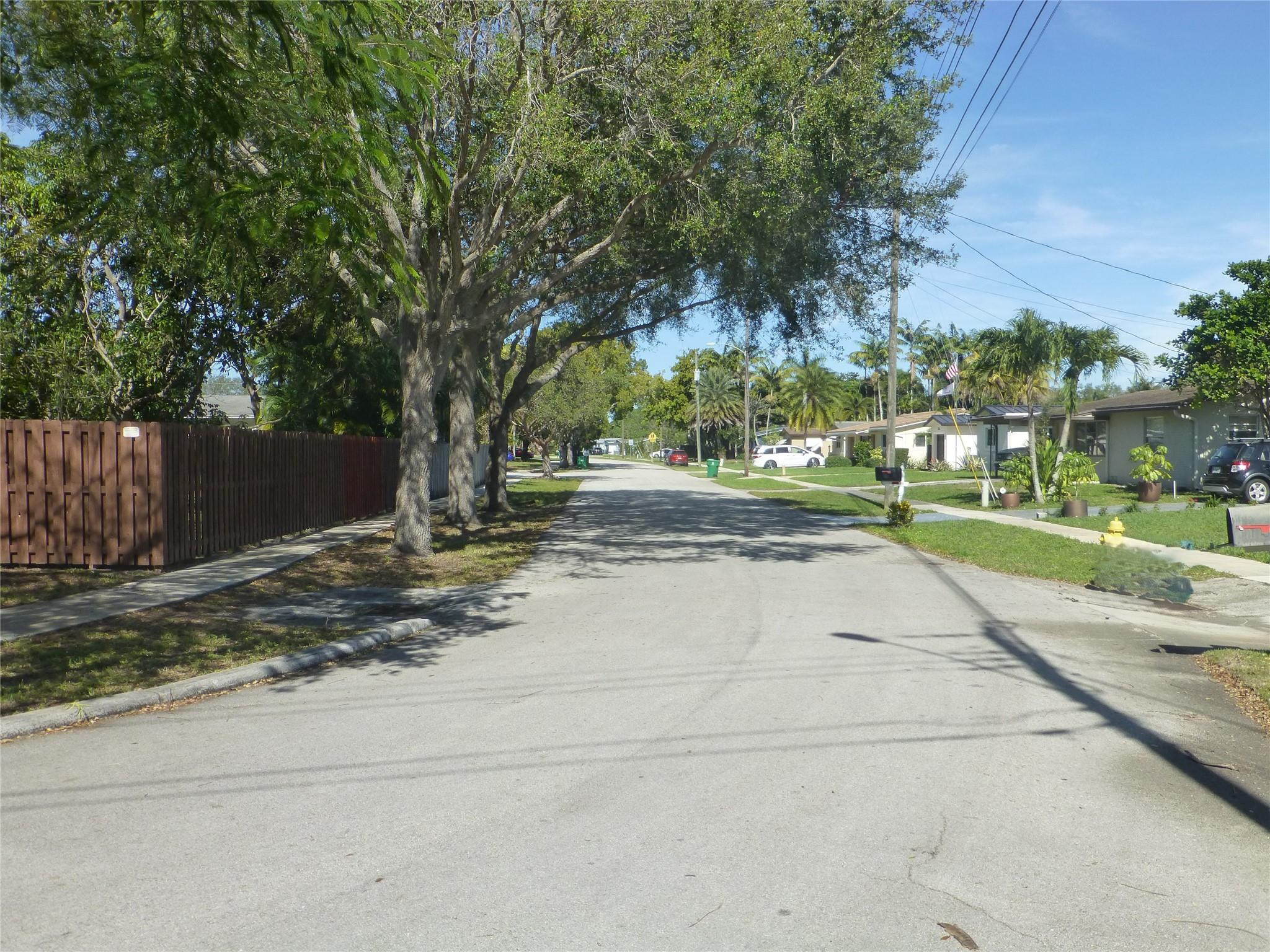 9401 Southwest 53rd Street Cooper City, FL 33328 - Photo 16 of 17 a view of street with houses