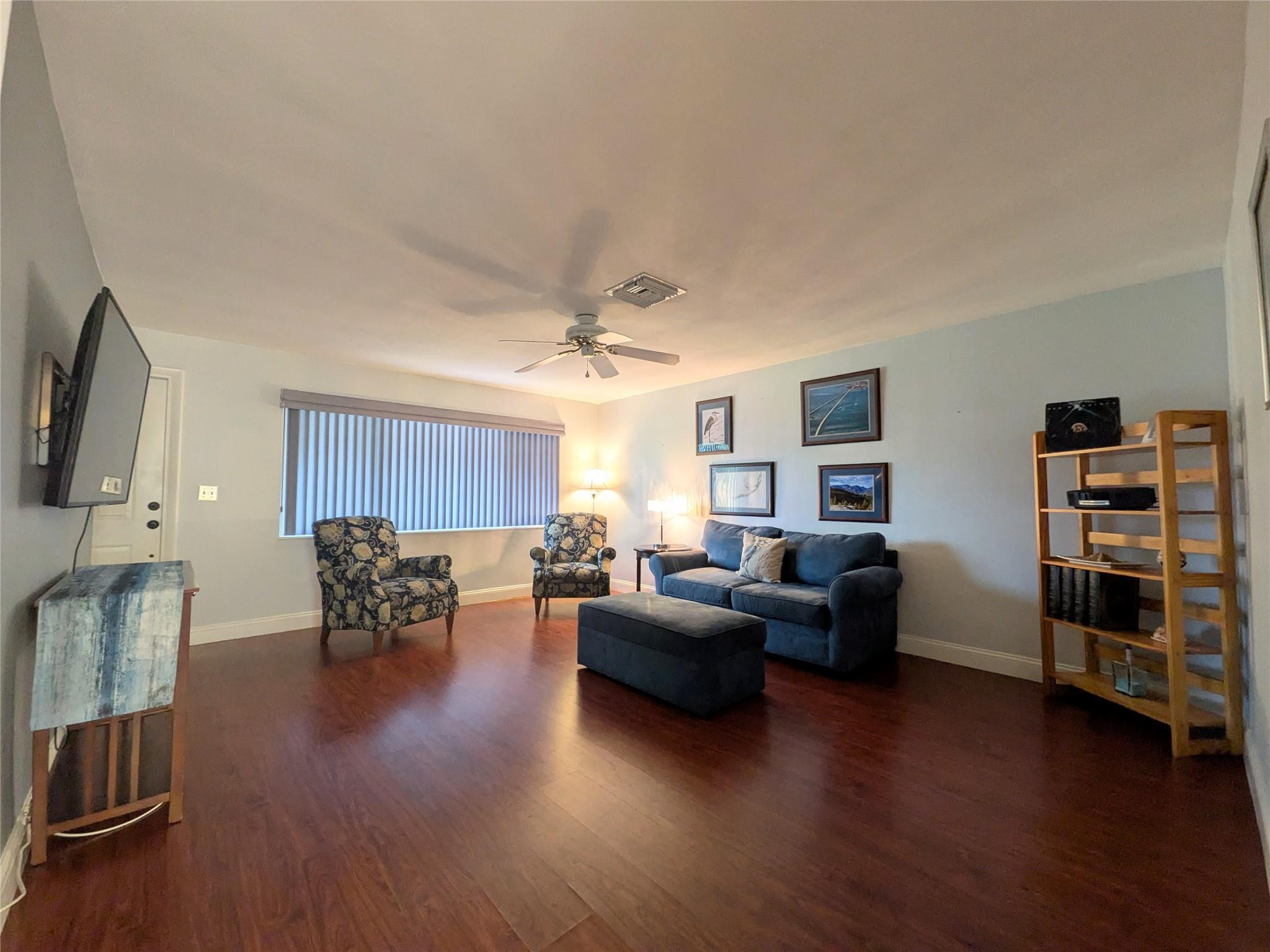 9401 Southwest 53rd Street Cooper City, FL 33328 - Photo 3 of 17 a living room with furniture and a wooden floor