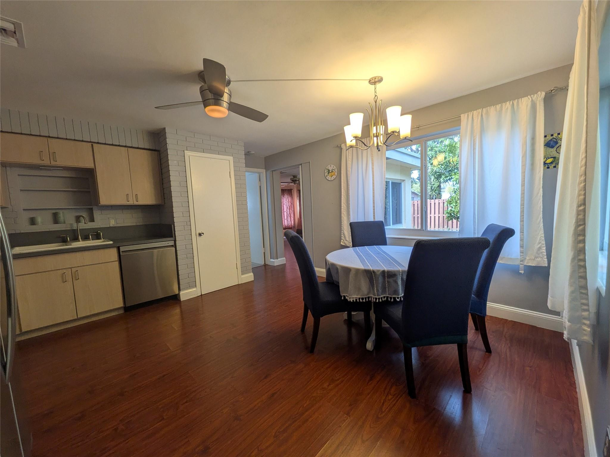 9401 Southwest 53rd Street Cooper City, FL 33328 - Photo 4 of 17 a view of a dining room with furniture window and wooden floor