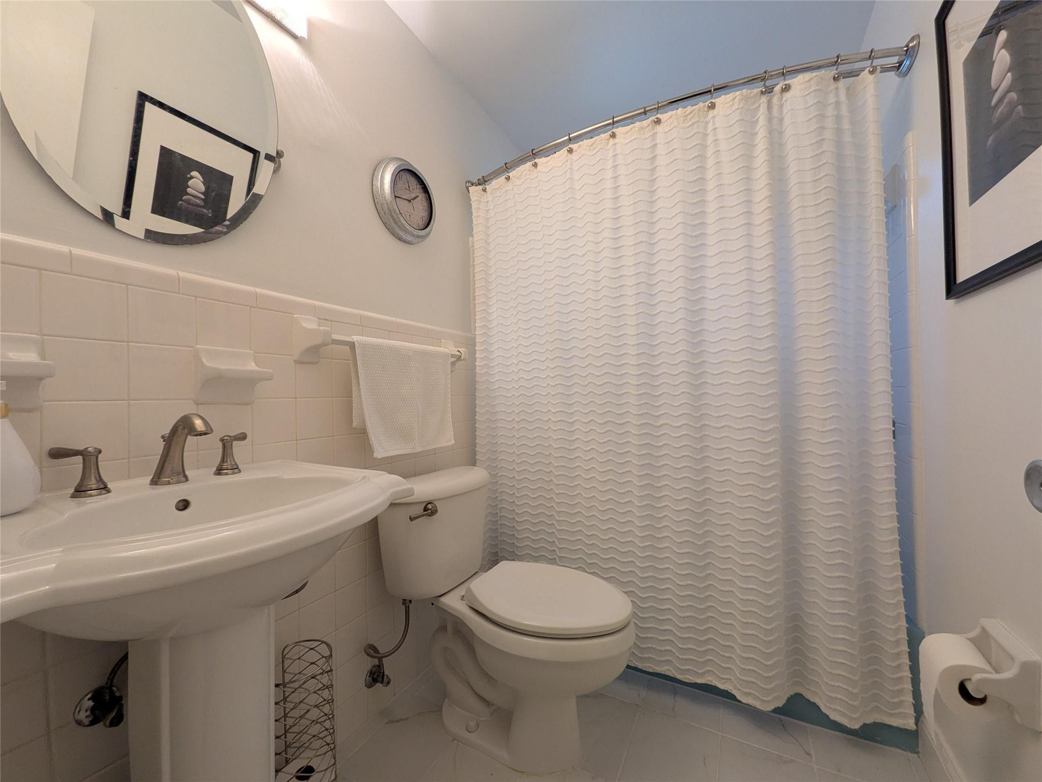 9401 Southwest 53rd Street Cooper City, FL 33328 - Photo 8 of 17 a bathroom with a sink a toilet and a mirror