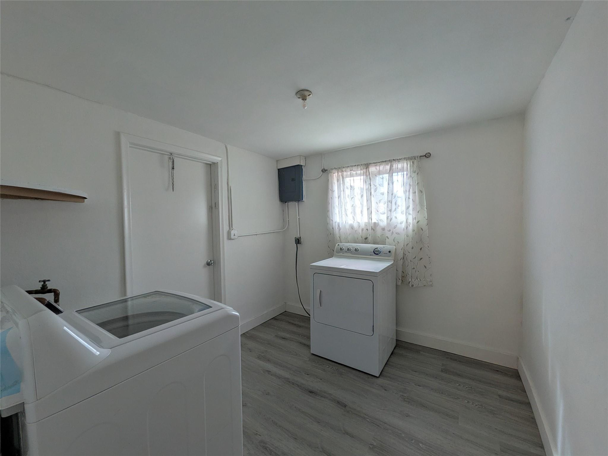 9401 Southwest 53rd Street Cooper City, FL 33328 - Photo 10 of 17 a room with a sink washer and dryer