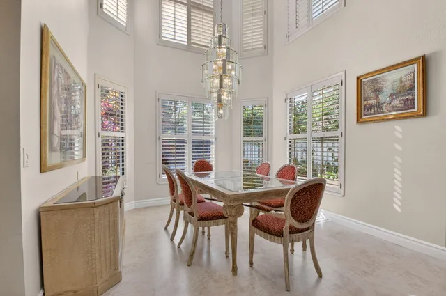 a bathroom with a bathtub shower sink and mirror