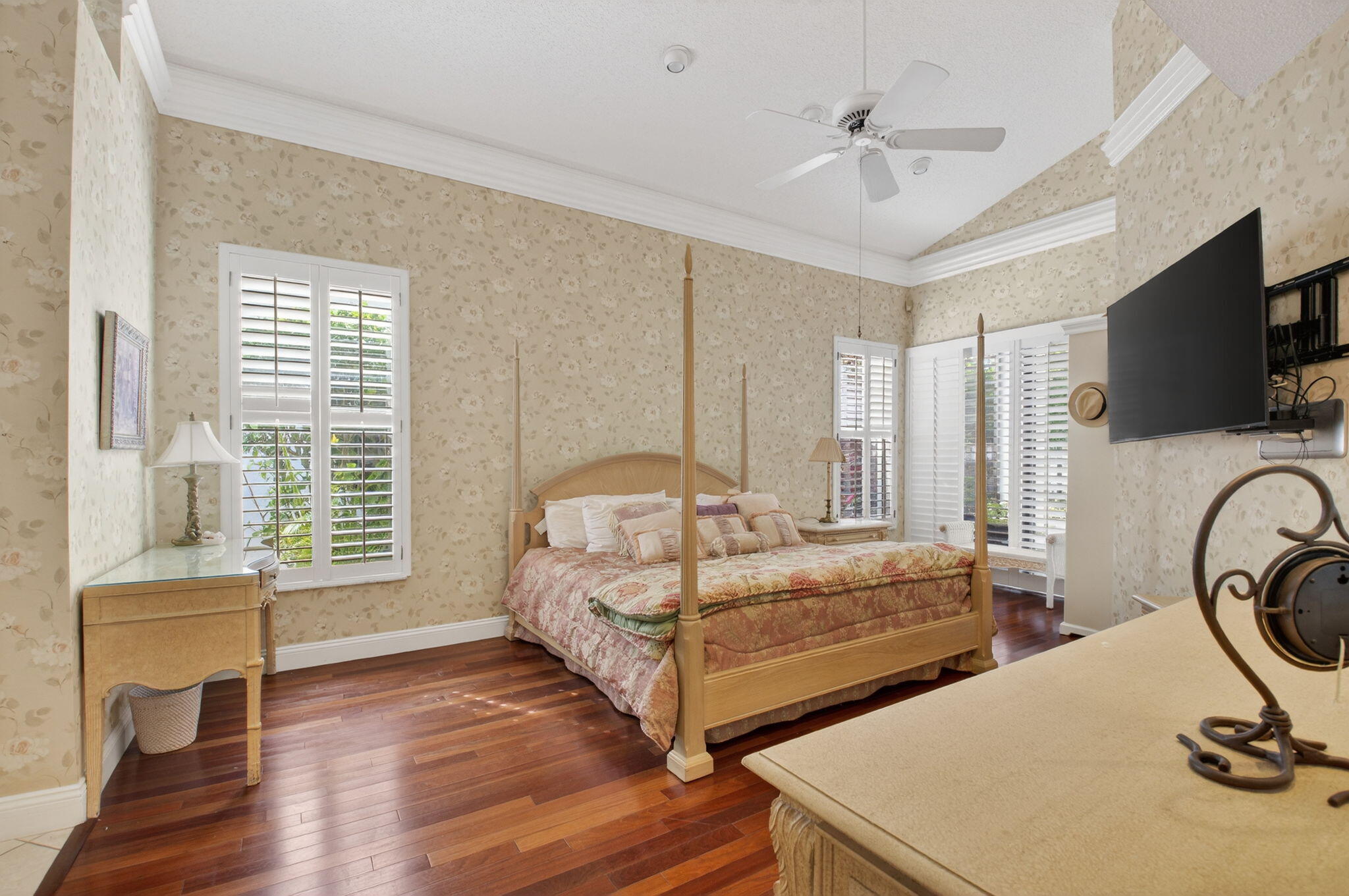 6395 Northwest 24th Avenue Boca Raton, FL 33496 - Photo 24 of 88 a spacious bedroom with two beds and a flat screen tv