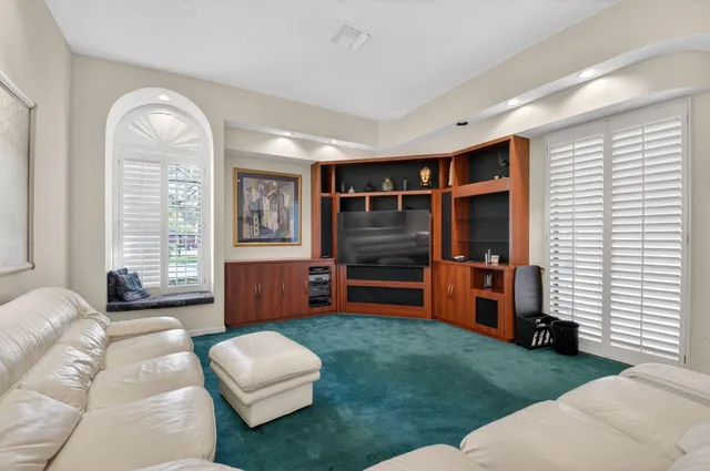 a living room with furniture and a table