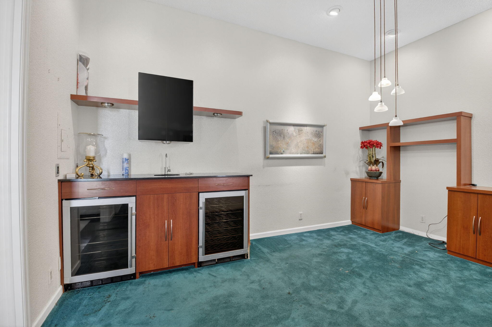 6395 Northwest 24th Avenue Boca Raton, FL 33496 - Photo 10 of 88 a living room with stainless steel appliances kitchen island granite countertop furniture and a flat screen tv
