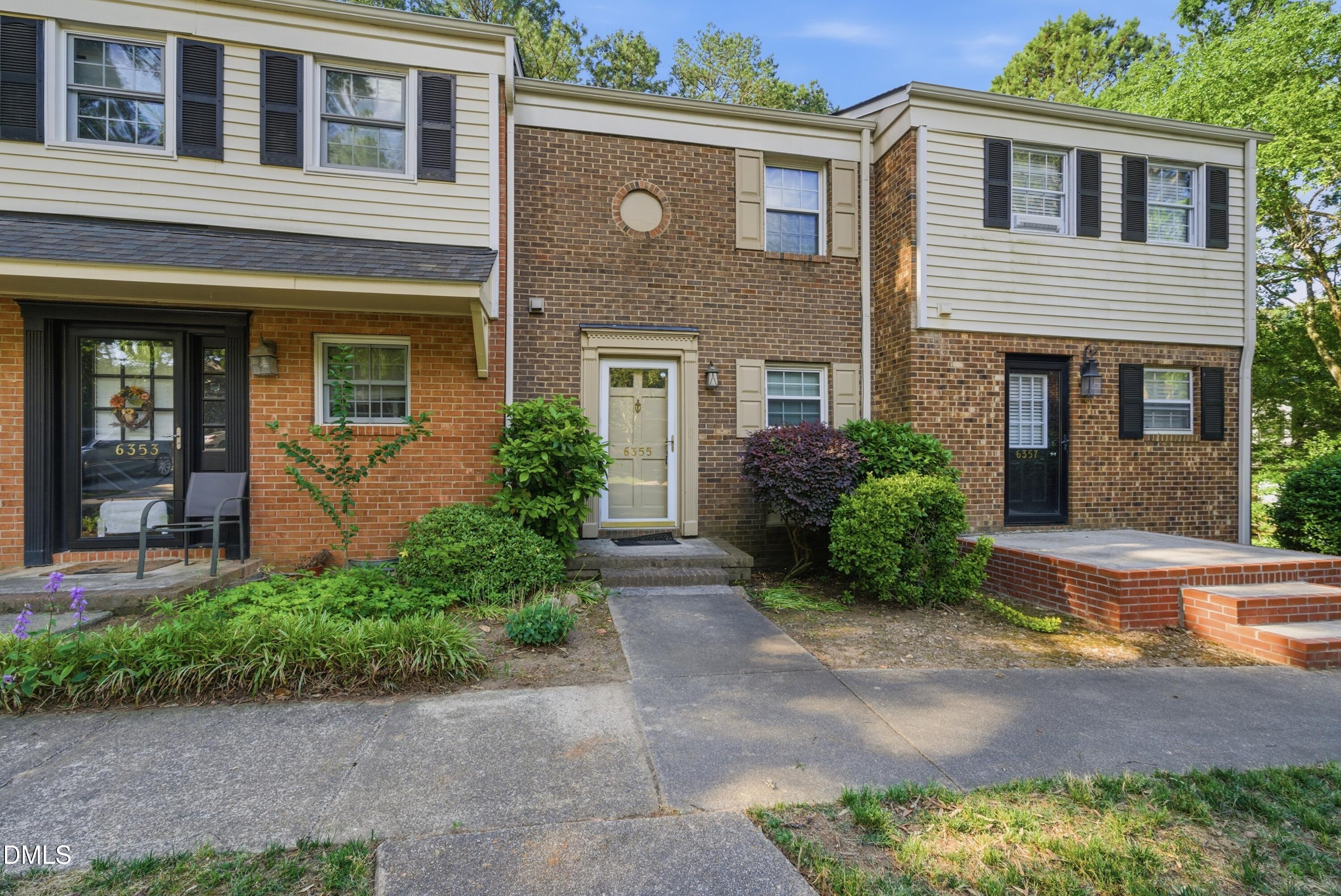 6355 New Market Way Raleigh, NC 27615 - Photo 2 of 30 a front view of a house with garden