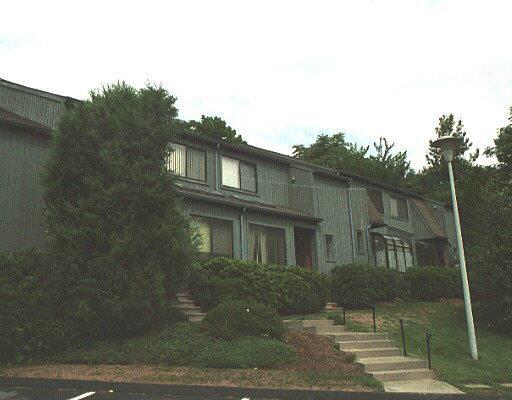 123 Old Belden Hill Road, Unit 47 Norwalk, CT 06850 - Photo 1 of 1 a view of a brick house next to a yard