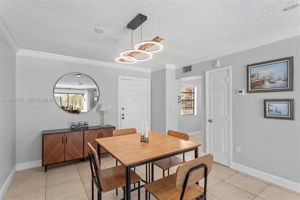 a view of a room that has a table and chairs