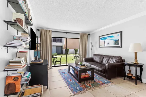 a living room with furniture and a lamp