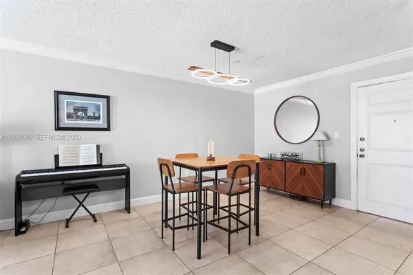 a view of a livingroom with furniture and a window