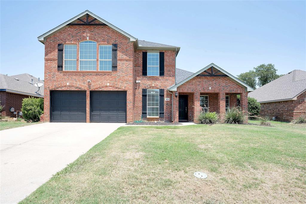 409 Springtree Road Lake Dallas, TX 75065 - Photo 1 of 1 front view of a house with a yard