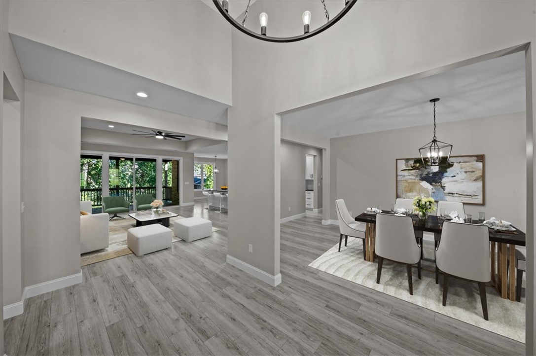 105 Bree Drive Anderson, SC 29621 - Photo 48 of 48 An open floorplan seamlessly connects the elegant dining area with a comfortable living space, featuring wood flooring throughout.