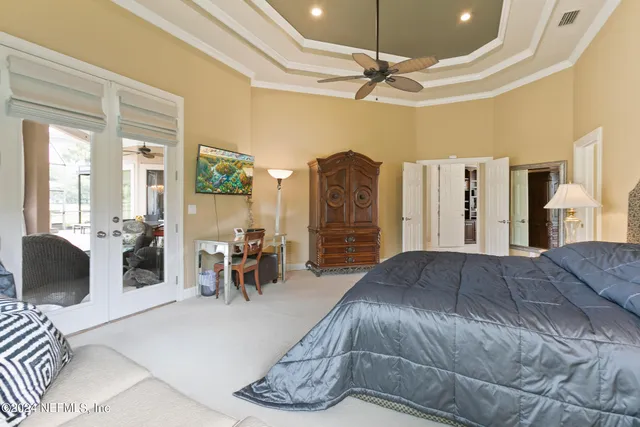 a room with pool table and glass windows