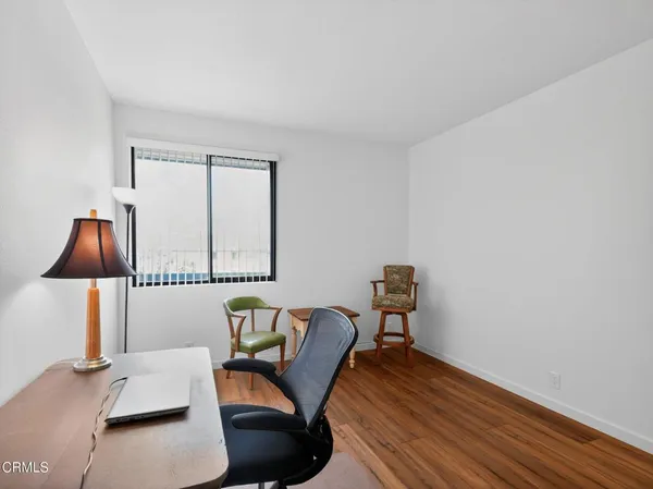 a workspace with furniture and window