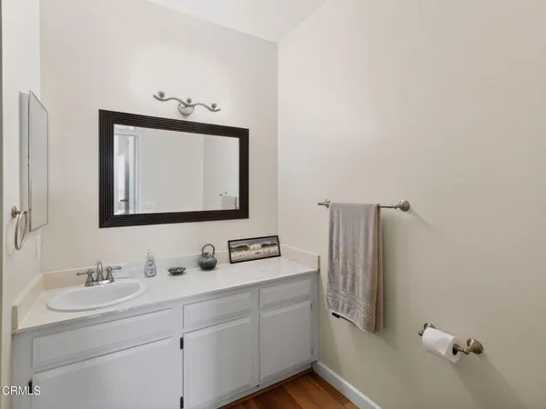 a bathroom with a double vanity sink and mirror