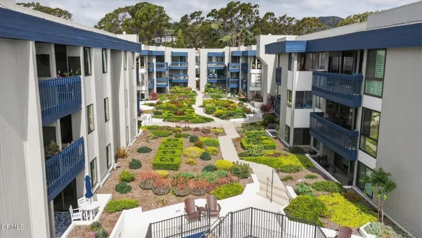 a view of yard with swimming pool and furniture