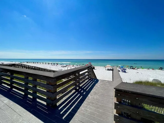 a view of a balcony with wooden floor and city view