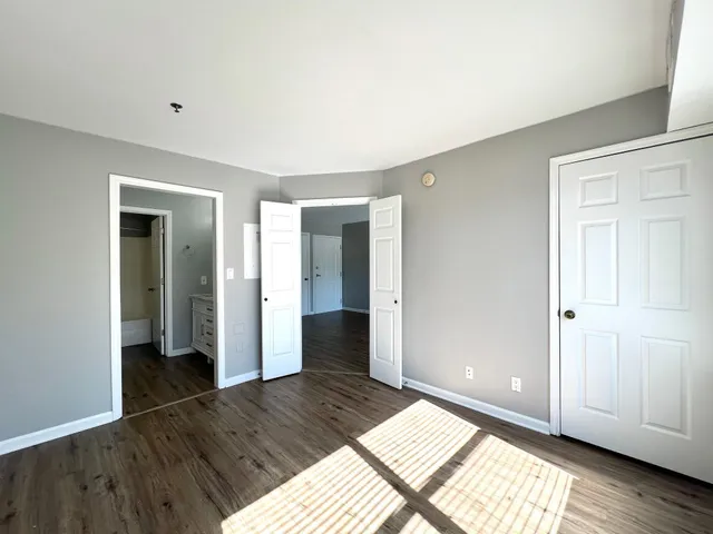 a view of an empty room and wooden floor