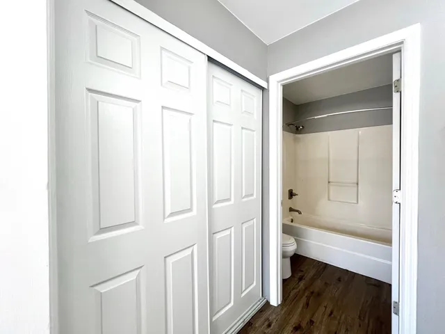 a bathroom with a bathtub and a shower